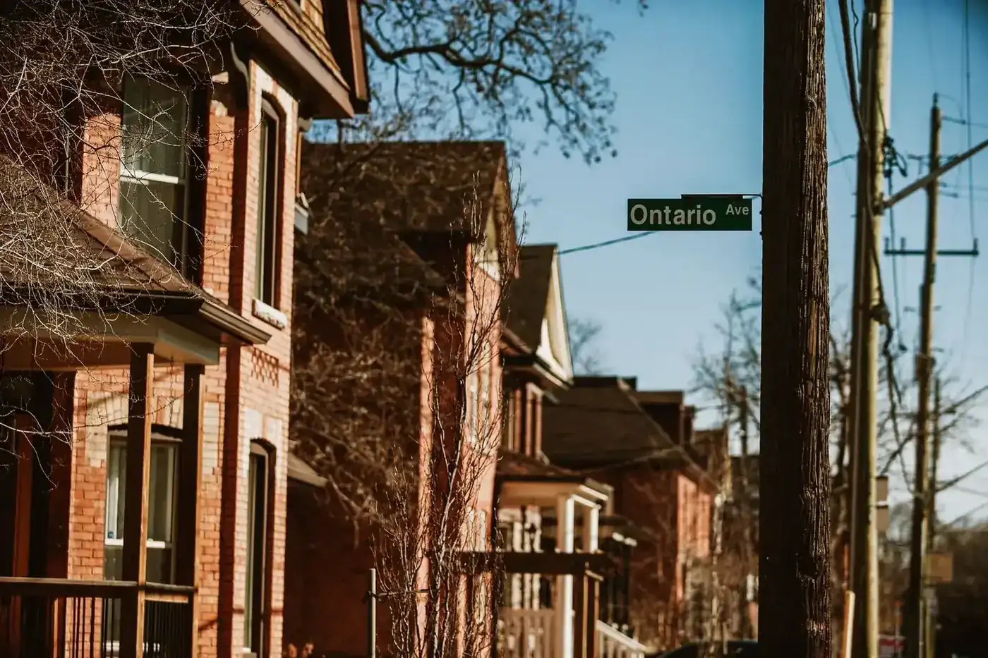 A row of historic brick homes on a residential street